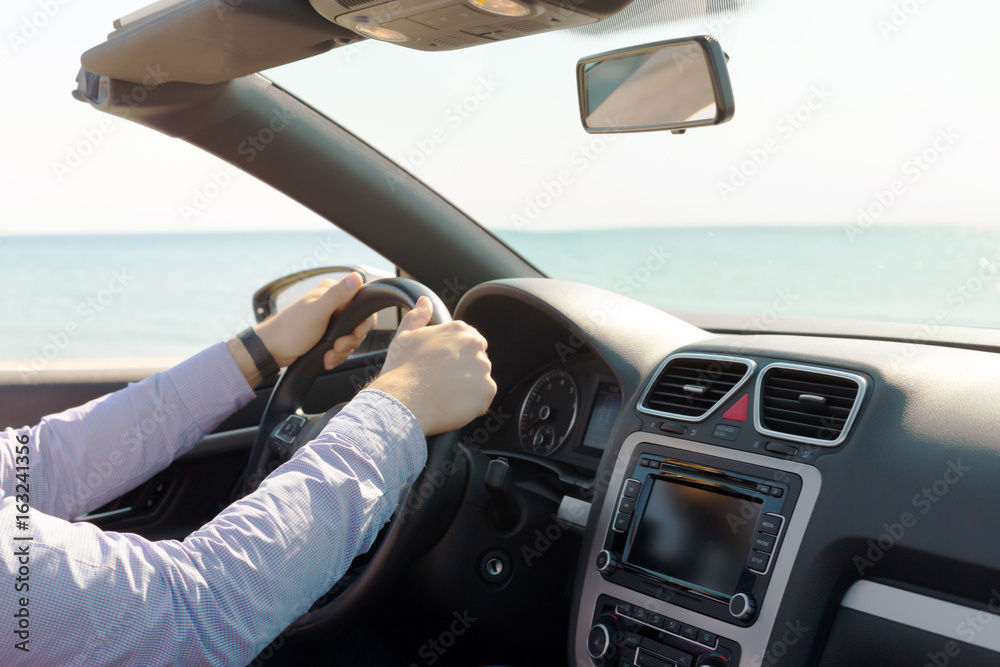 Fototapeta premium Man driving a car