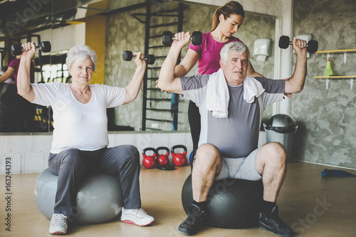 Obraz na plátně Senior people workout in rehabilitation center