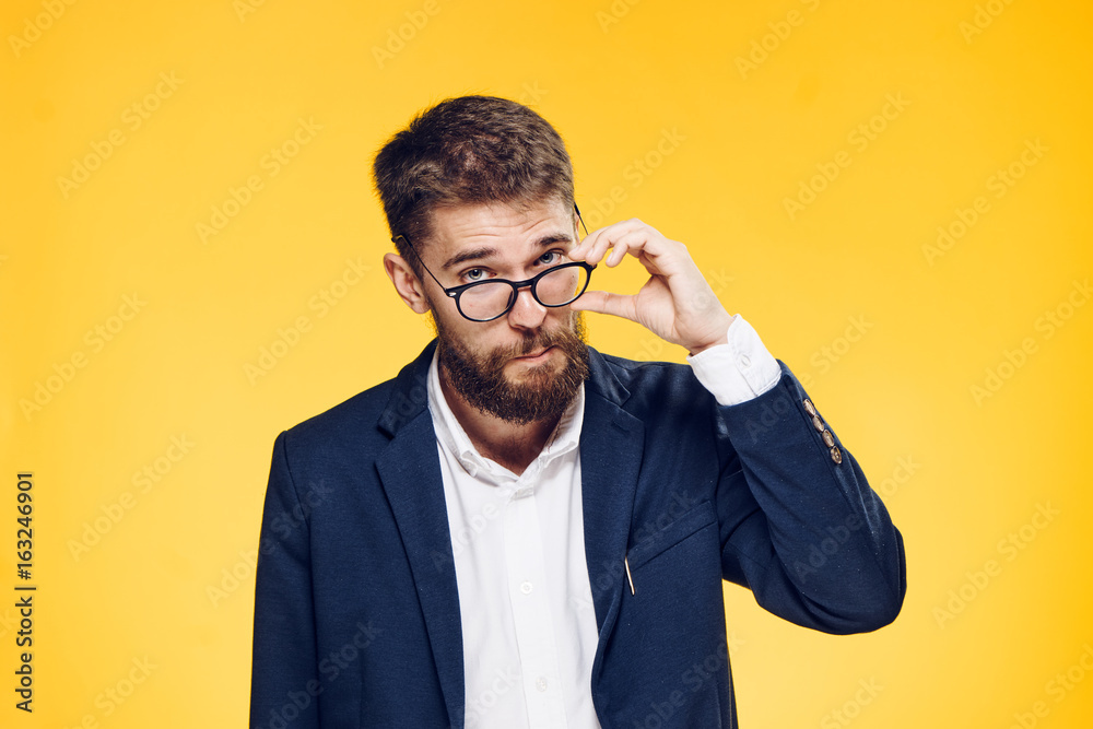 Business man with a beard on a yellow background, portrait Business man with a beard on a yellow background, portrait