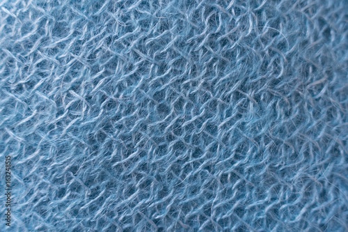 Close up of light blue handmade mohair knitted fabric