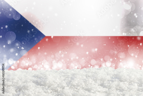 Obraz na plátně Defocused Czech Republic flag as a winter Christmas background with falling snow