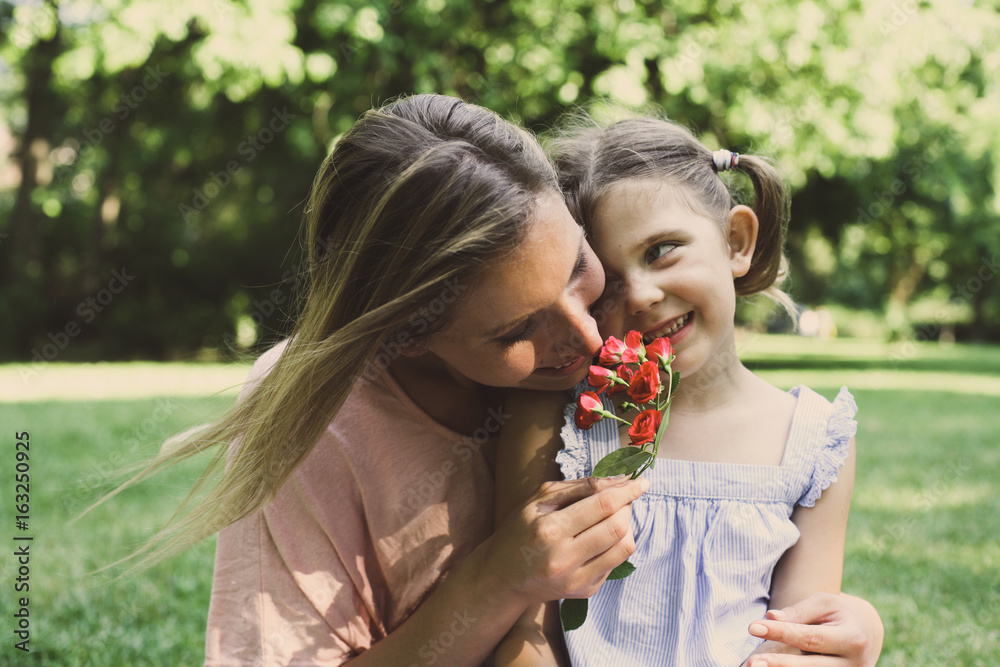 Daughter chose a flower to his mother. Daughter chose a flower to his mother.