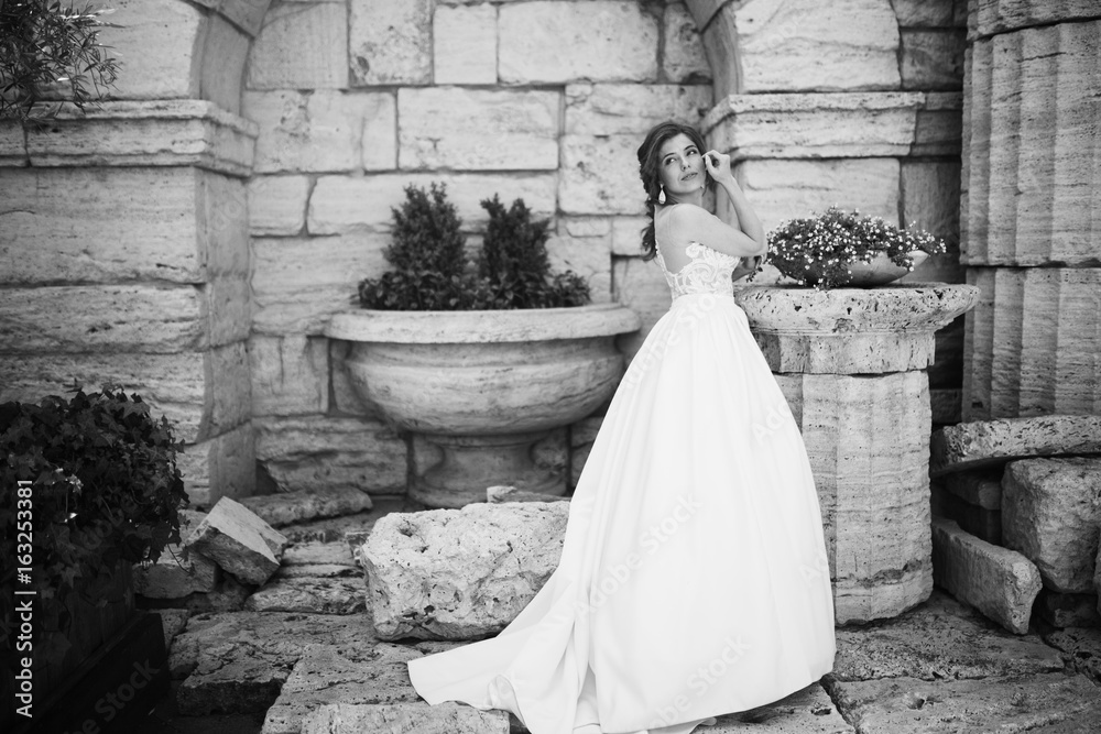 Stunning bride in the old garden at summer Stunning bride in the old garden at summer