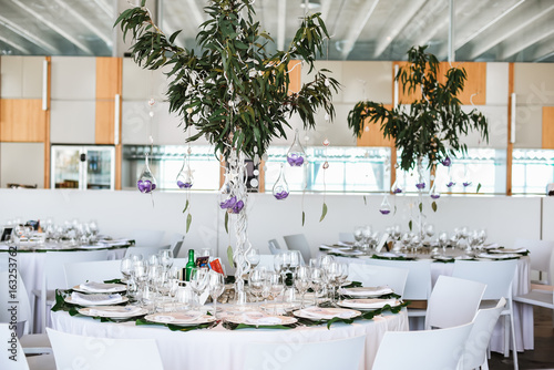 Restaurant tables decorated for wedding celebration