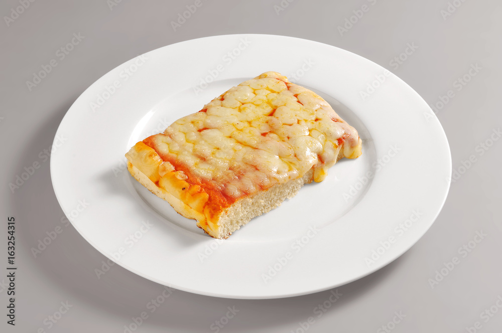 Round dish with square pizza piece Round dish with square pizza piece