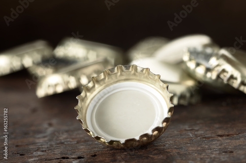 Pile of gold aluminium bottle tops