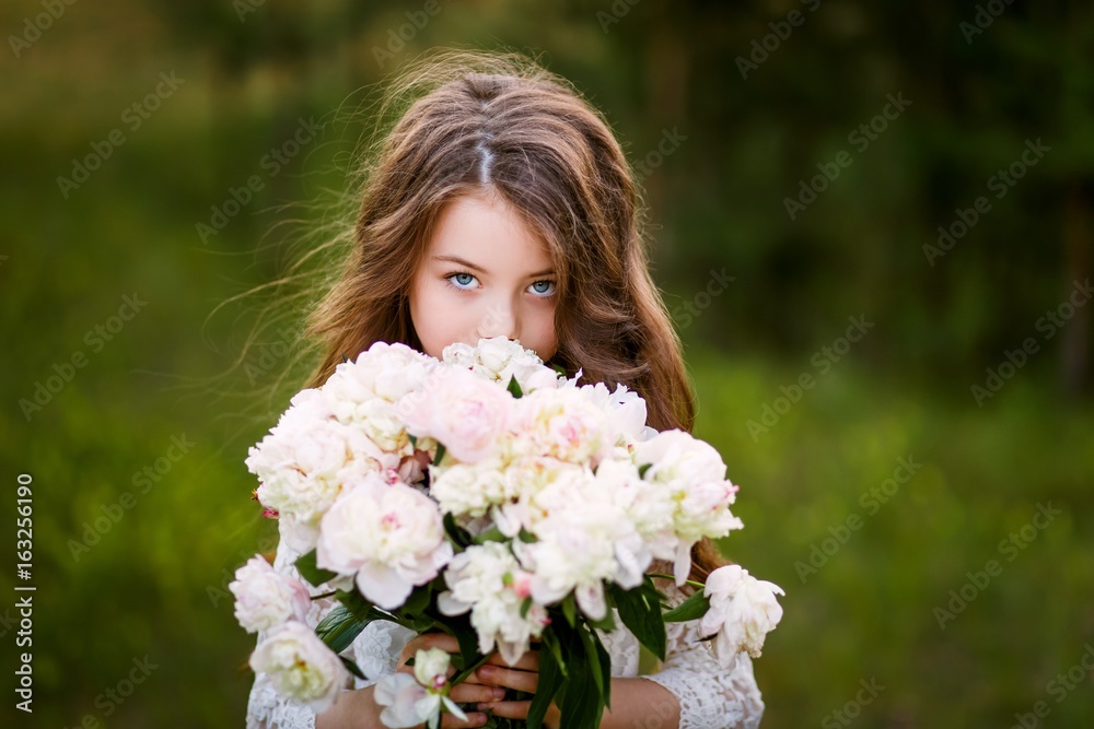 little girl six years old with brown hair and blue eyes with a bouquet of peony flowers wearung white dress, smiling little girl six years old with brown hair and blue eyes with a bouquet of peony flowers wearung white dress, smiling