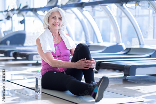 Senior lady having pause at gym © zinkevych