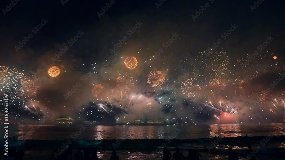 Night firework above the ocean bay. Shevelev.