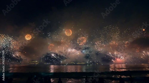 Night firework above the ocean bay. Shevelev.