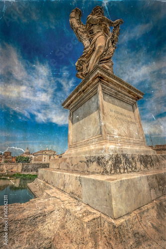 Old photo with statue of Agnel from Angel's Bridge, in front of castle San Angelo