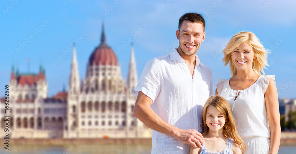 Obraz premium happy family over house of parliament in budapest