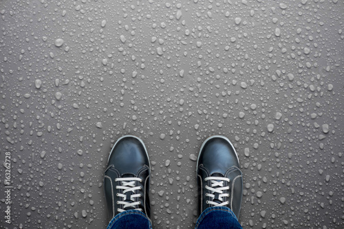 Black shoes standing on wet floor