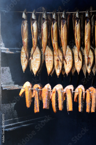 fresh smoked fish in smoker photo