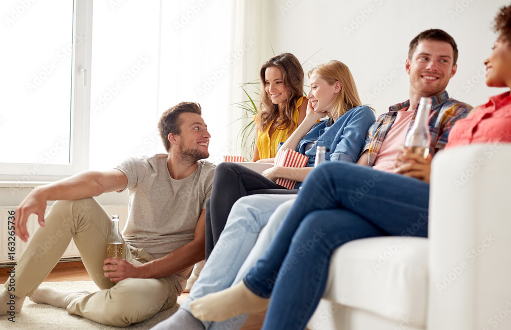 happy friends with popcorn and beer at home happy friends with popcorn and beer at home