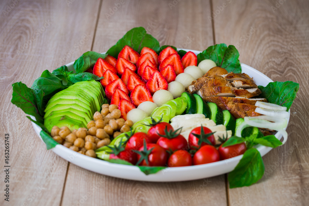 Warm grilled chicken salad with vegetables and fruits Warm grilled chicken salad with vegetables and fruits