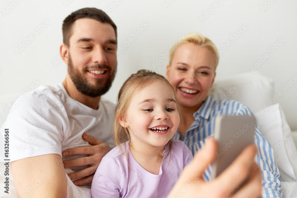 happy family taking selfie by smartphone at home happy family taking selfie by smartphone at home