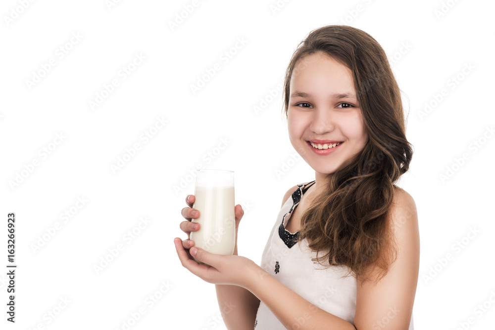 portrait of young smiling teenager girl with glass of milk, right view portrait of young smiling teenager girl with glass of milk, right view