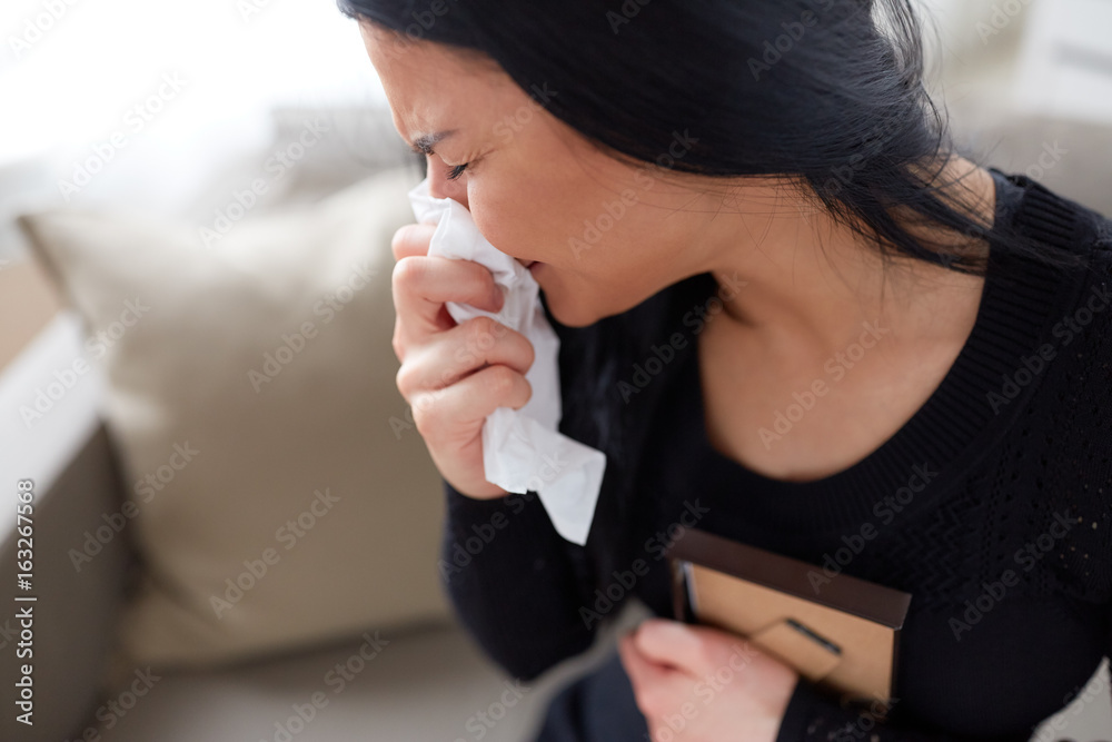 crying woman with photo frame at funeral day crying woman with photo frame at funeral day