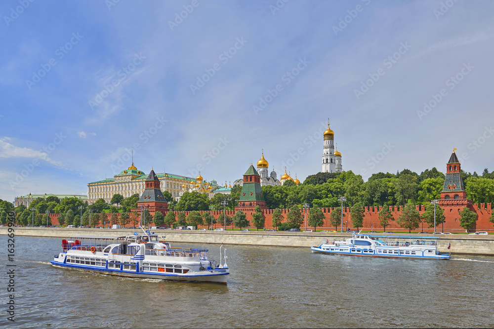 Panoramic view on Moscow Red Square, Kremlin towers, Kremlin Palace, Ivan bell tower church, Moscow river. Excursion river travel cruise boats ships. Famous Moscow Red Square tours vacations