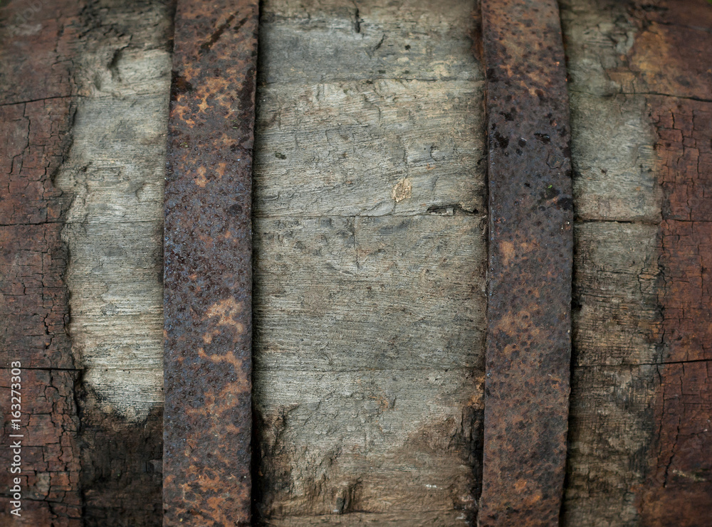 old rubbish barrel is covered with rusty metal stripes old rubbish barrel is covered with rusty metal stripes