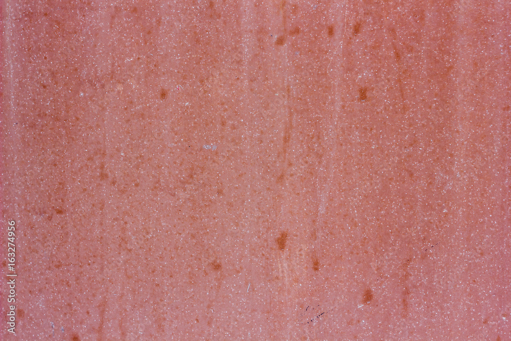 Fototapeta premium Pink plaster concrete wall texture as a background.