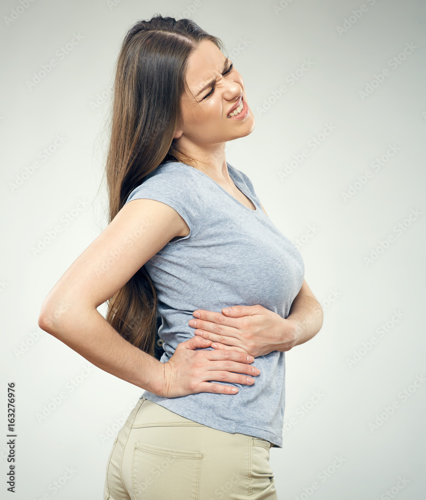 Young woman with back pain Young woman with back pain