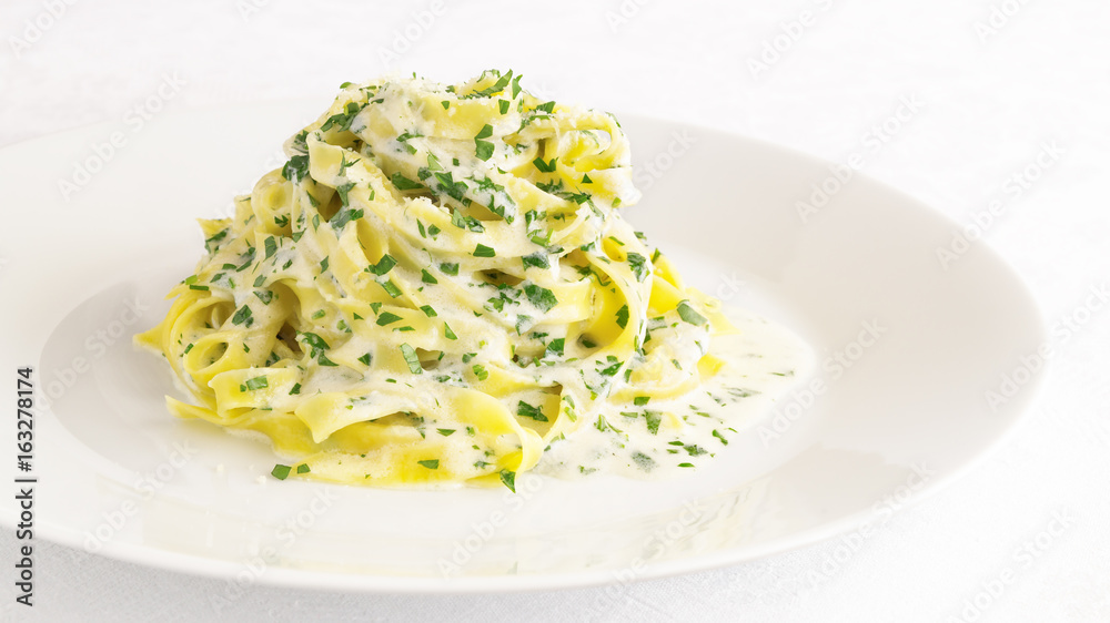 fettuccine with parmesan butter sauce with addition of cream and parsley fettuccine with parmesan butter sauce with addition of cream and parsley