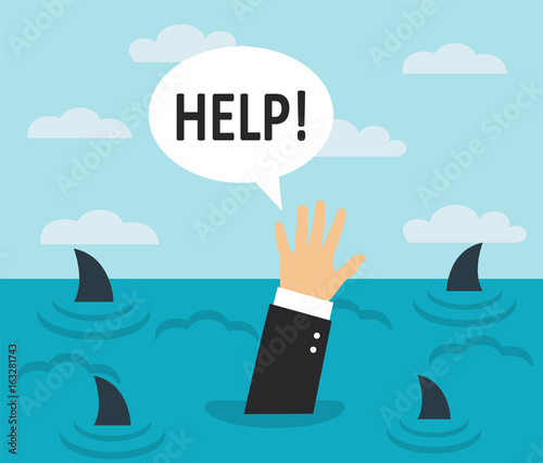 Businessman drowning in the sea with sharks. On the surface of the water, a man's hand asks for help