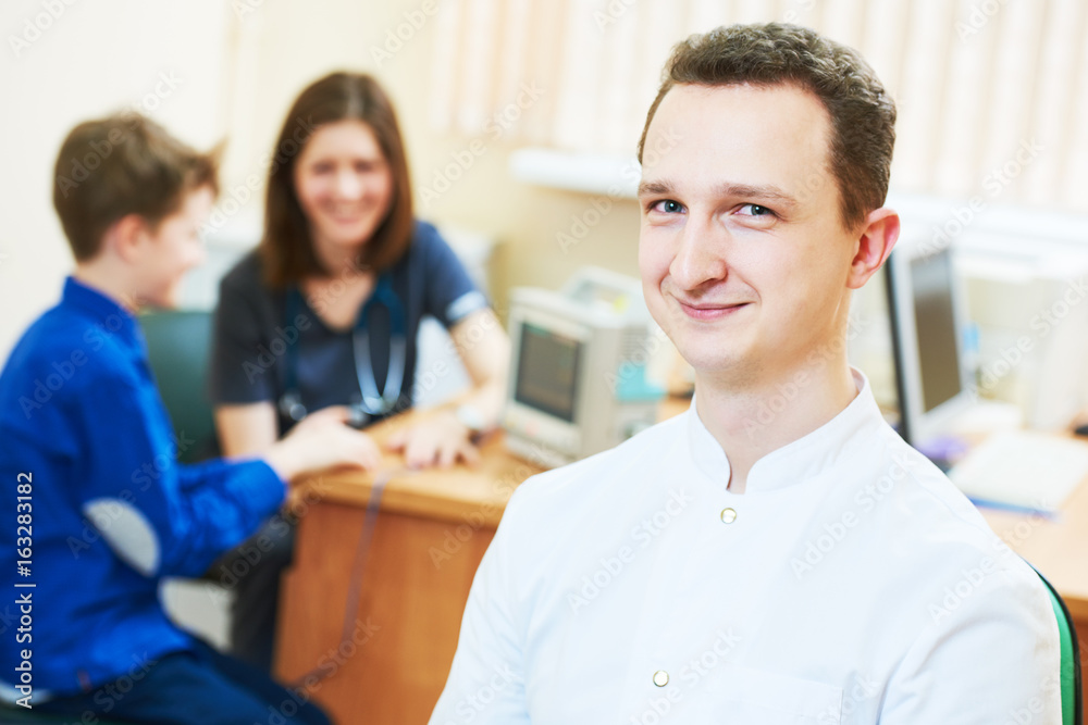 male children's doctor in front of pediatrician little boy examination male children's doctor in front of pediatrician little boy examination