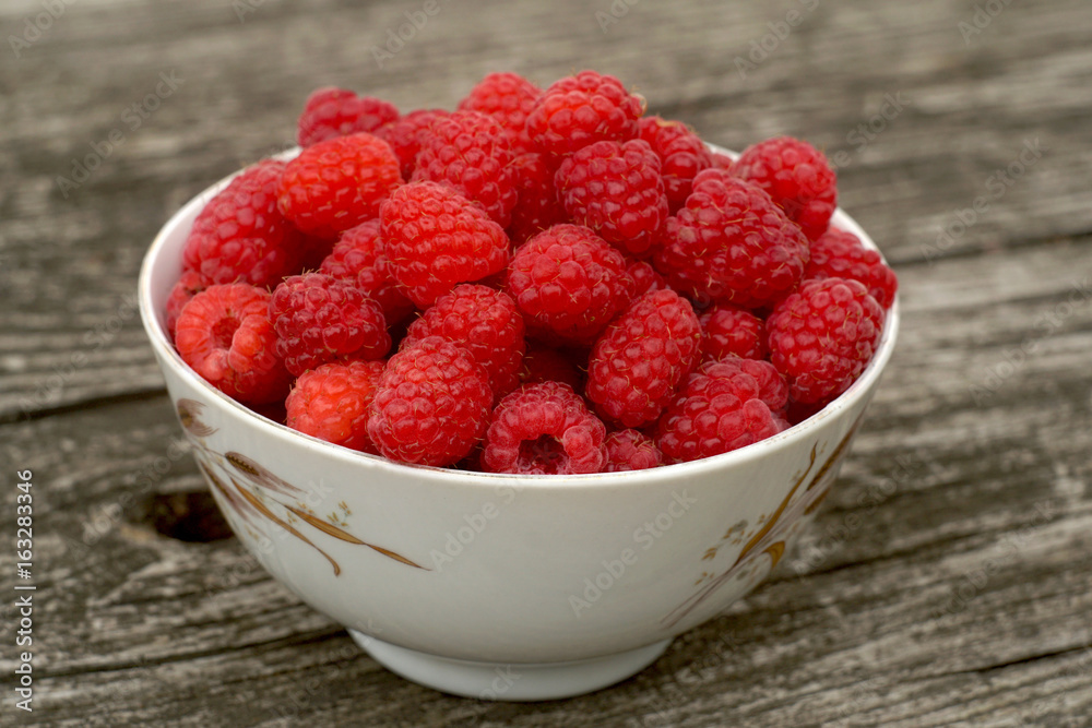 fresh sweet raspberry plate on wooden table fresh sweet raspberry plate on wooden table