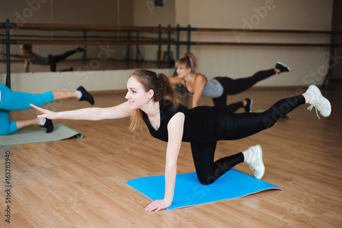 Women doing sport in gym, healthcare lifestyle people concept, modern loft studio