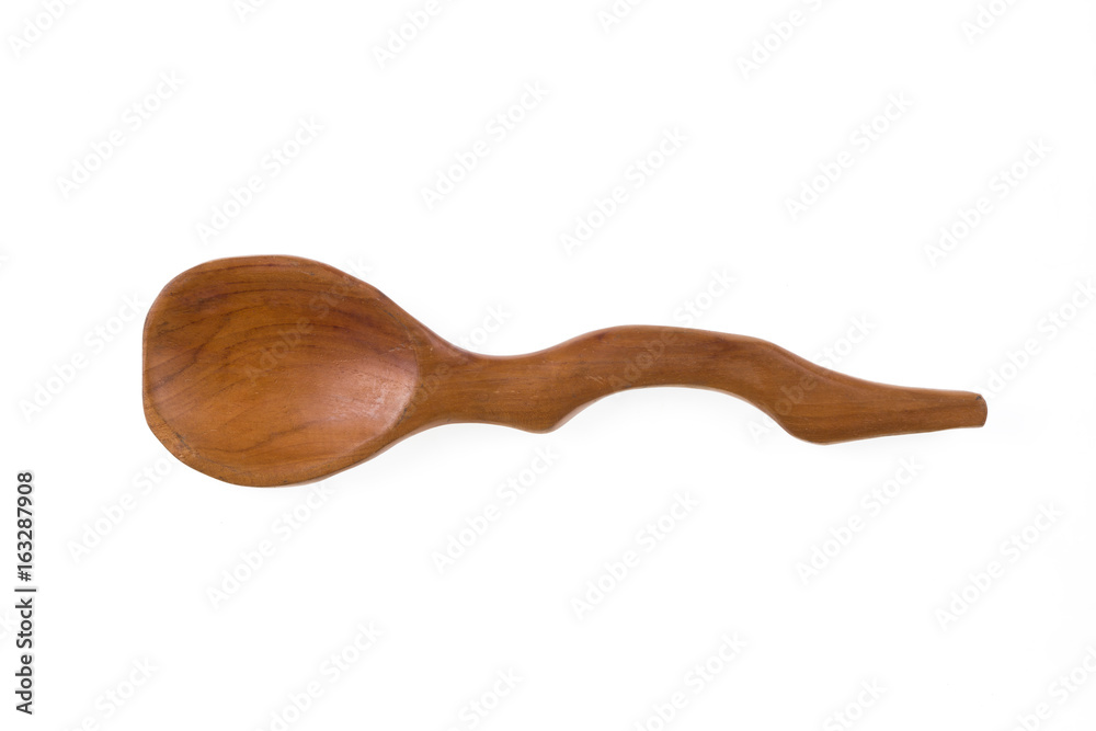 Old rustic, ornate, curved, wooden spoon Old rustic, ornate, curved, wooden spoon