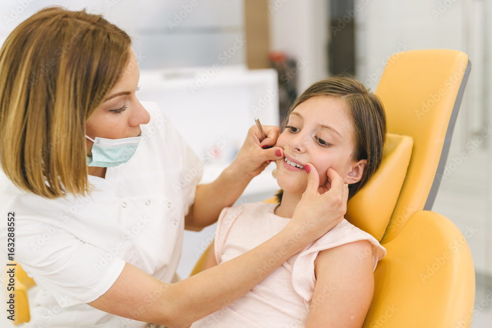 little girl at the dentist