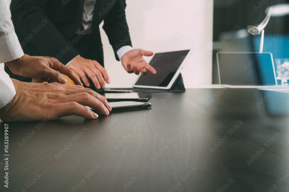 co working team meeting concept,businessman using smart phone and digital tablet and laptop computer in modern office with glass reflected view co working team meeting concept,businessman using smart phone and digital tablet and laptop computer in modern office with glass reflected view