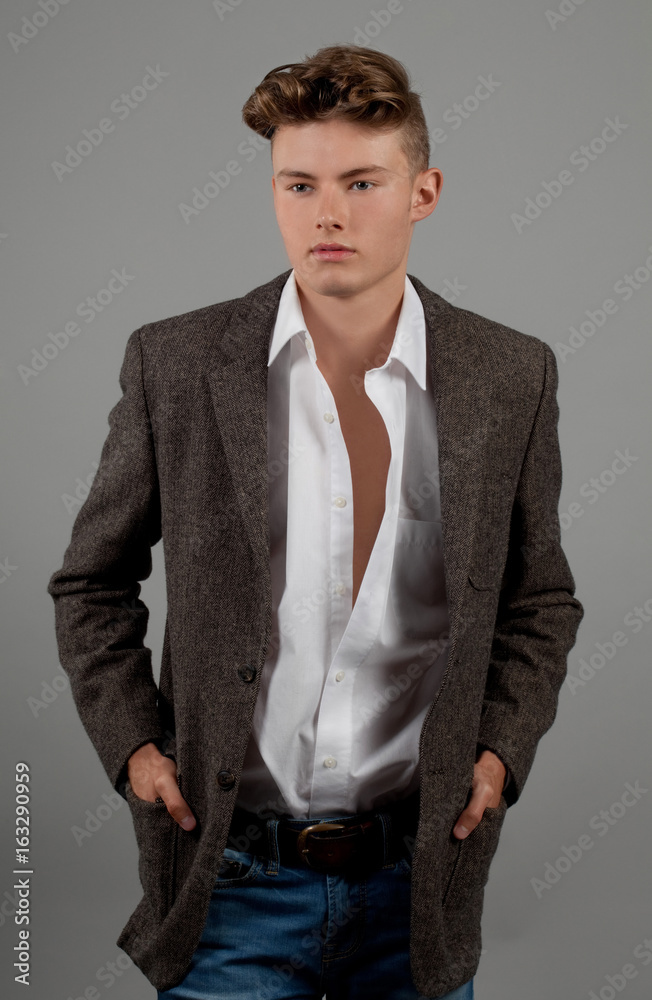 Attractive Young Man in Unbuttoned Shirt and Blazer Stock Photo | Adobe  Stock