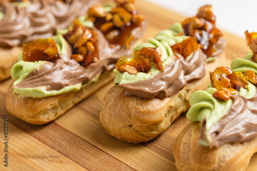 Tradilional french eclaire with cream decoration