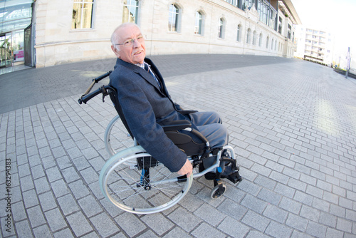 Portrait of elderly man on paved street
