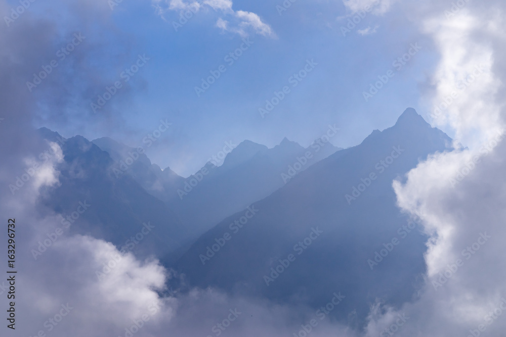 Rugged Andes Mountains through Clouds