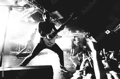 Guitarist on a stage, black and white