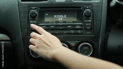 Touch the radio in the car photo