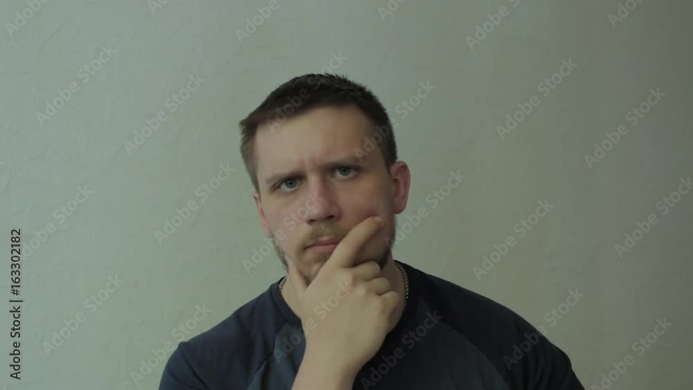 Thoughtful man disagrees. Looking at camera. Thoughtful man disagrees. Looking at camera.