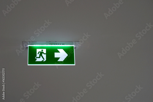 green emergency exit sign