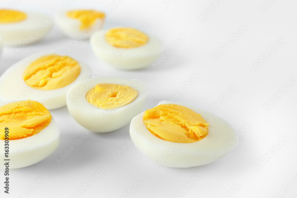 Sliced hard boiled eggs on white background. Nutrition concept Sliced hard boiled eggs on white background. Nutrition concept