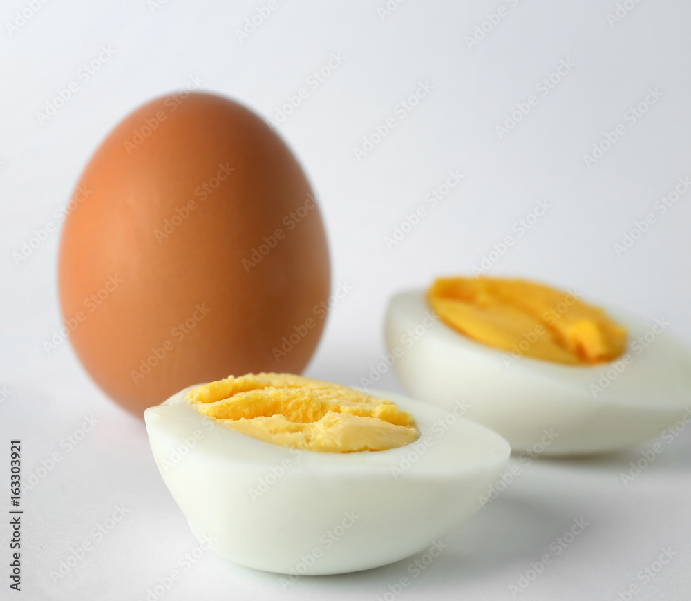 Hard boiled eggs on white background. Nutrition concept