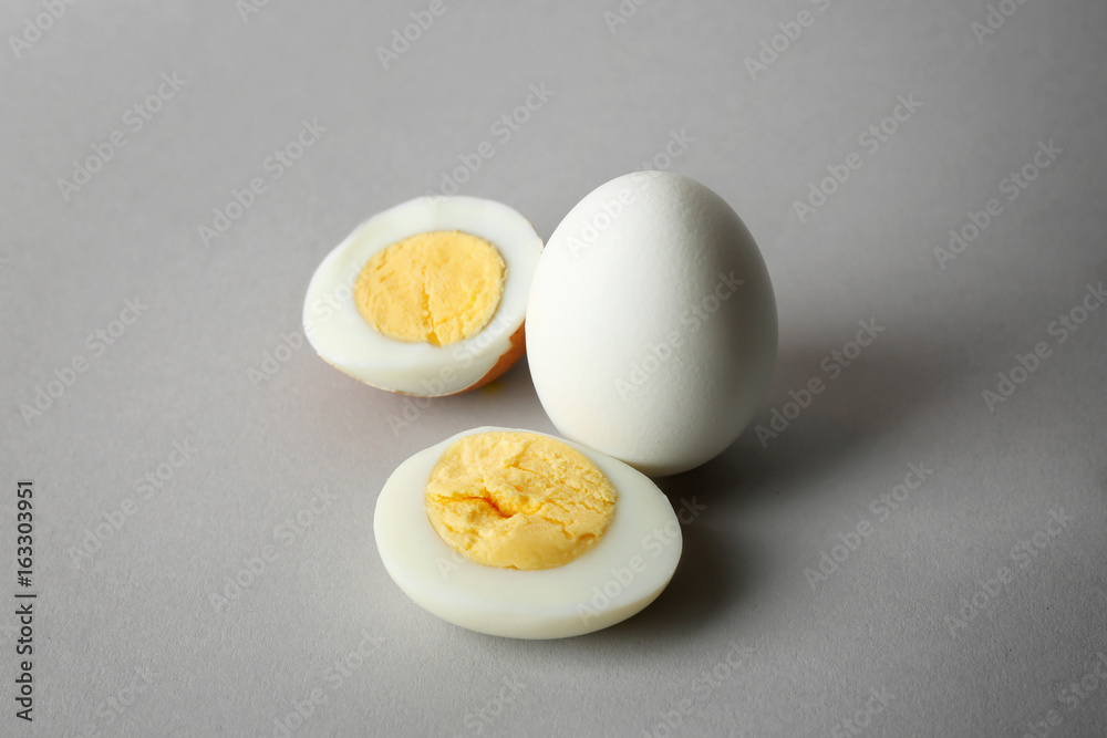 Hard boiled eggs on grey background. Nutrition concept
