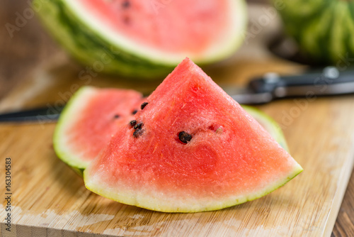 Portion of Fresh Watermelon on wooden background (selective focus).