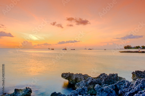 Vászonkép Sunset over the Caribbean Sea by George Town coast, Grand Cayman, Cayman Islands