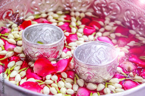 jasmine and rose leaf in bowl for bless adults, Thai traditional for Mother's day or Father's day in thailand.