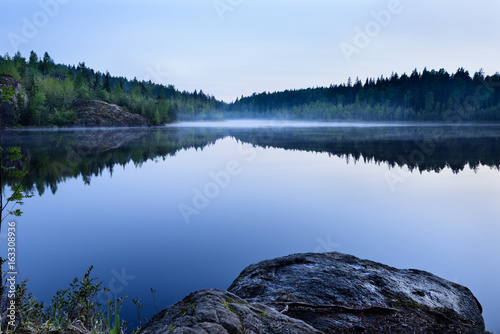 Lake Covered With Morning Mist, Karelia landscape Scandinavia Travel destination. © juliet_boo